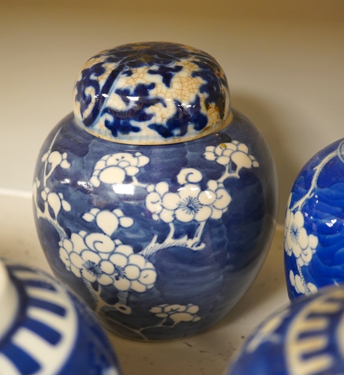 Eight Chinese blue and white ginger jars, one prunus vase and two others, the vase 25cm high. Condition - varies